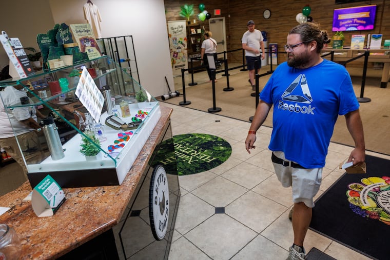 Matthew Fisher of Delaware walking through store on first day of recreation sale of cannabis at Thrive Dispensary in Wilmington Delaware, Friday, August 1, 2025.