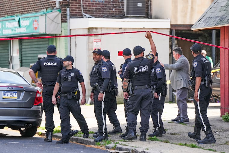 Philadelphia police at the scene where a police officer was shot, near Overbrook High School on Wednesday.