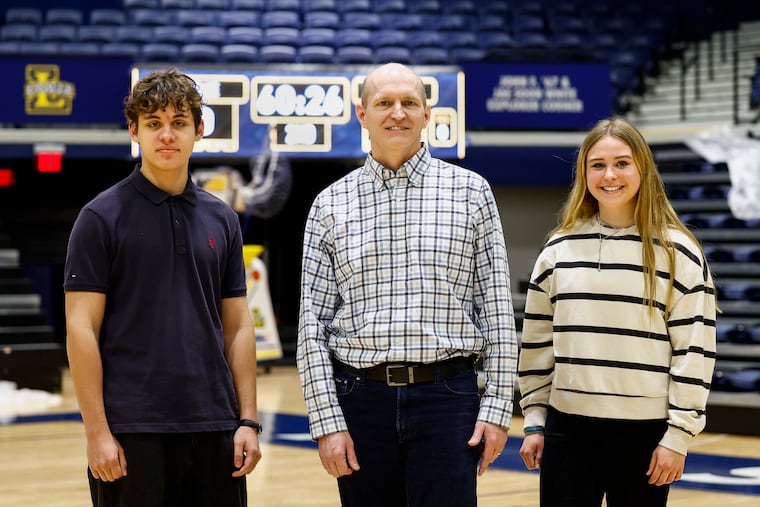 Professor T.J. Highley, center, and students Ilia Volkov, left, and Tannah Duncan, right, posed for a portrait at La Salle University on Monday, April 13, 2026 in Philadelphia. The three published an academic paper that offered a solution for tanking in the NBA.