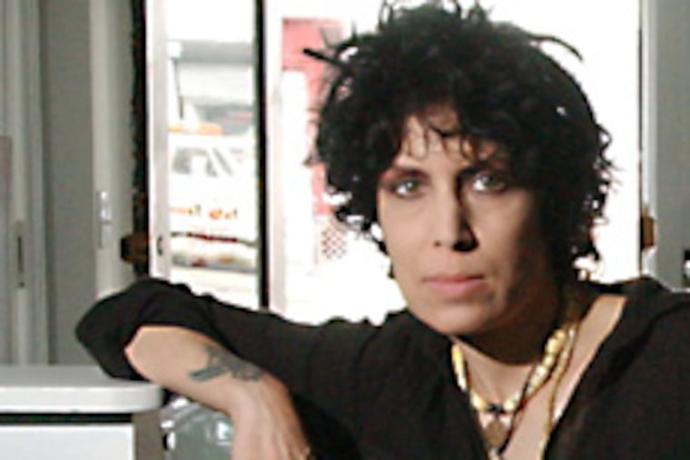 Jennifer Bates, in her bookstore, Germ, where she sold only what she would like to read.