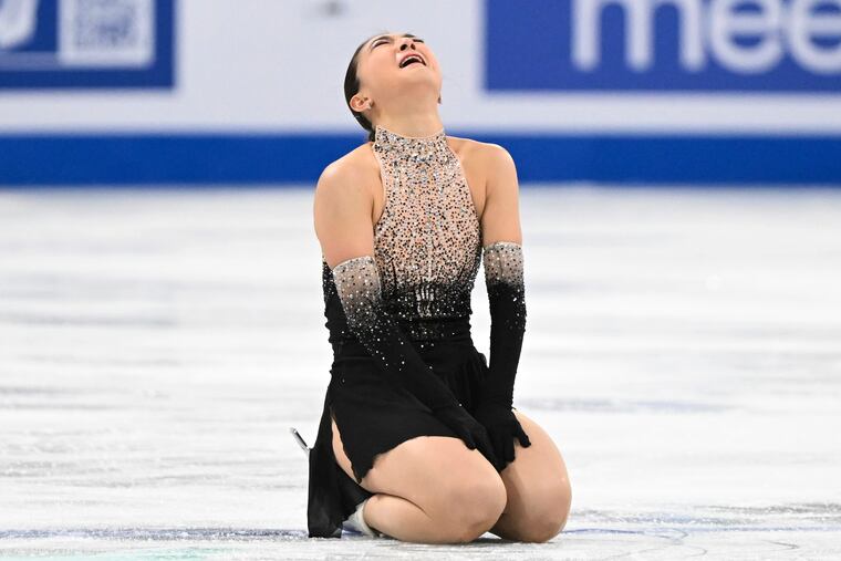Kaori Sakamoto, of Japan, reacts following her free skate at the world figure skating championships on Friday in Montreal.
