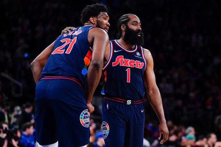 Philadelphia 76ers' Joel Embiid, left, and James Harden, right, look to head coach Doc Rivers during the second half of an NBA basketball game against the New York Knicks Sunday, Feb. 27, 2022, in New York. The 76ers won 125-109.(AP Photo/Frank Franklin II)