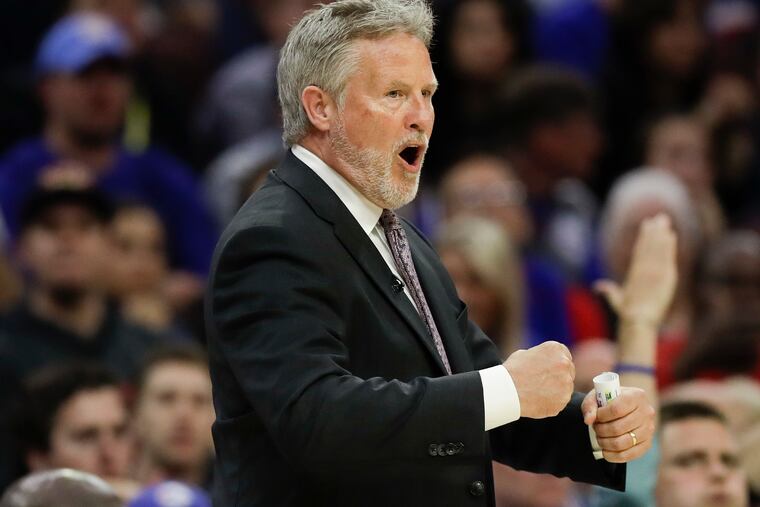 Sixers coach Brett Brown pumps his fist during the second-quarter against the Toronto Raptors on Thursday.