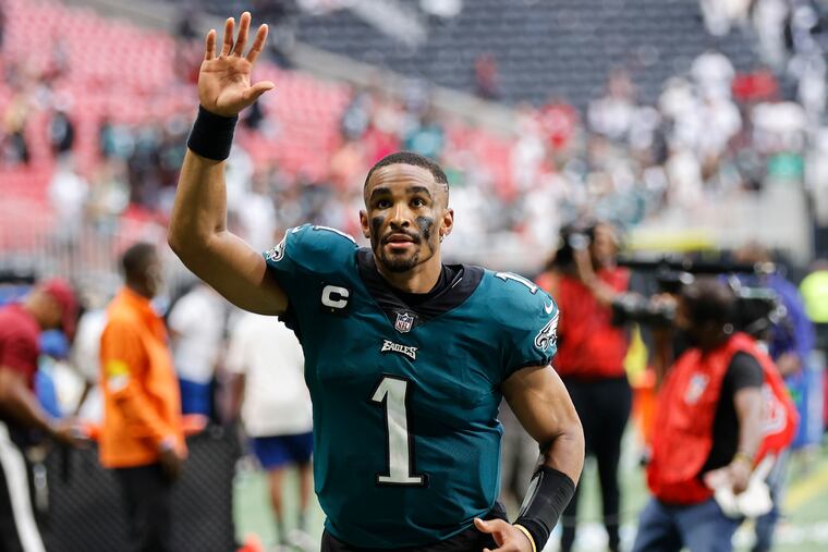 Eagles quarterback Jalen Hurts waves to fans after the Eagles beat the Atlanta Falcons 32-6 on Sunday.
