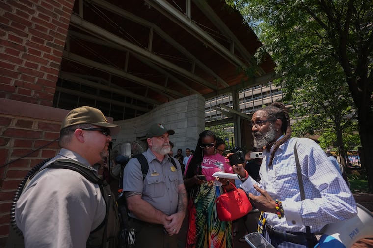 Lawyer Michael Coard advocates for his first amendment rights to gather and speak freely at the President's House site on Wednesday.