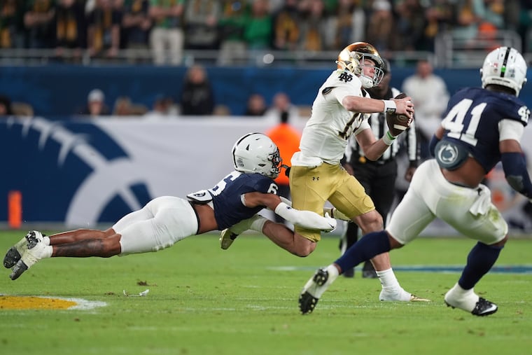 Penn State safety Zakee Wheatley sacks Notre Dame quarterback Riley Leonard during the College Football Playoff semifinal in Miami.