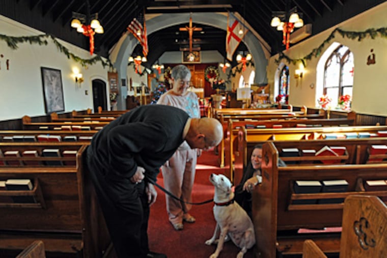 St. James Episcopal Church in Prospect Park, where the Rev. John Wallace (left) is to be named part-time pastor, has struggled with debt. With him: Senior warden Dottie Paullin (center) and his wife, Trisha. (April Saul / Staff Photographer)