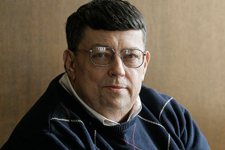 Evening rush hour traffic moves down the Vine Street Expressway on Friday. (Laurence Kesterson / Staff Photographer)