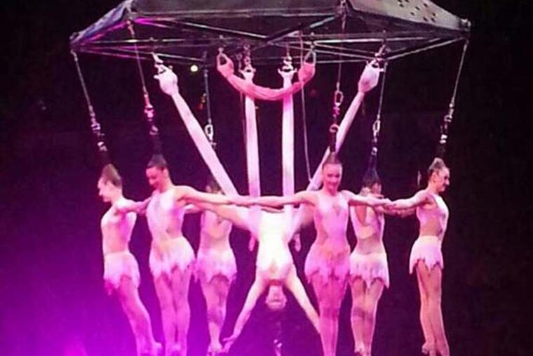 In this photo provided by Frank Caprio, performers hang during an aerial hair-hanging stunt at the Ringling Brothers and Barnum and Bailey Circus, Friday, May 2, 2104, in Providence, R.I. A platform collapsed during an aerial hair-hanging stunt at the 11 a.m. performance Sunday, May 4, sending eight acrobats plummeting to the ground. At least nine performers were seriously injured in the fall, including a dancer below, while an unknown number of others suffered minor injuries. (AP Photo/Frank Caprio) MANDATORY CREDIT