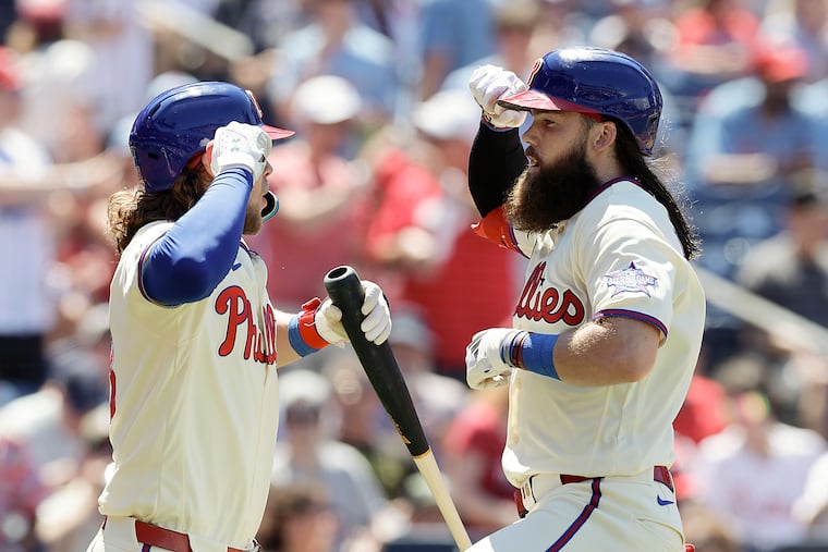 Brandon Marsh celebrates his solo home run in the third inning with teammate Alec Bohm against the Chicago White Sox on Sunday.