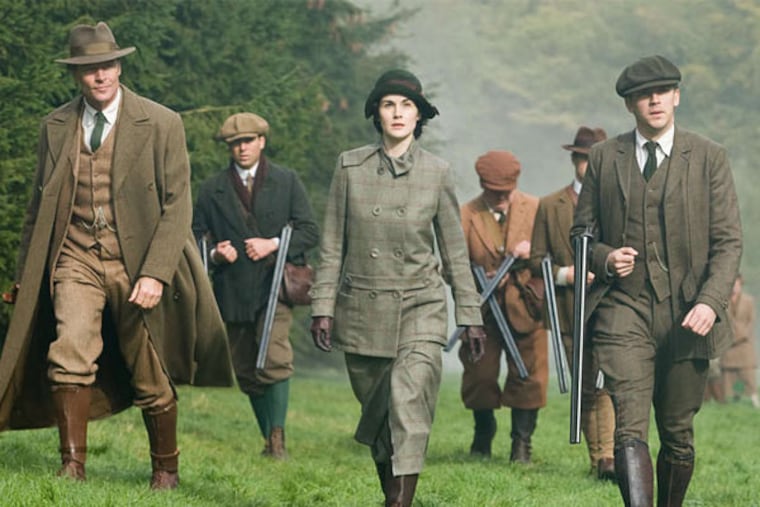The hunting party in "Downton Abbey" - (from left) Iain Glen as Sir Richard Carlisle, Michelle Dockery as Lady Mary, and Dan Stevens as Matthew Crawley – wearing the tweed outfits on display at Winterthur.