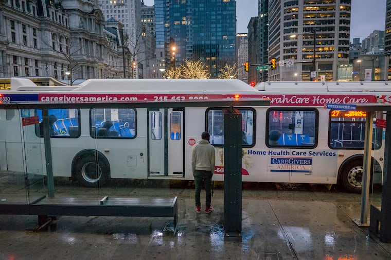 A SEPTA bus at 15th and JFK runs nearly empty during the commuting hour in March.