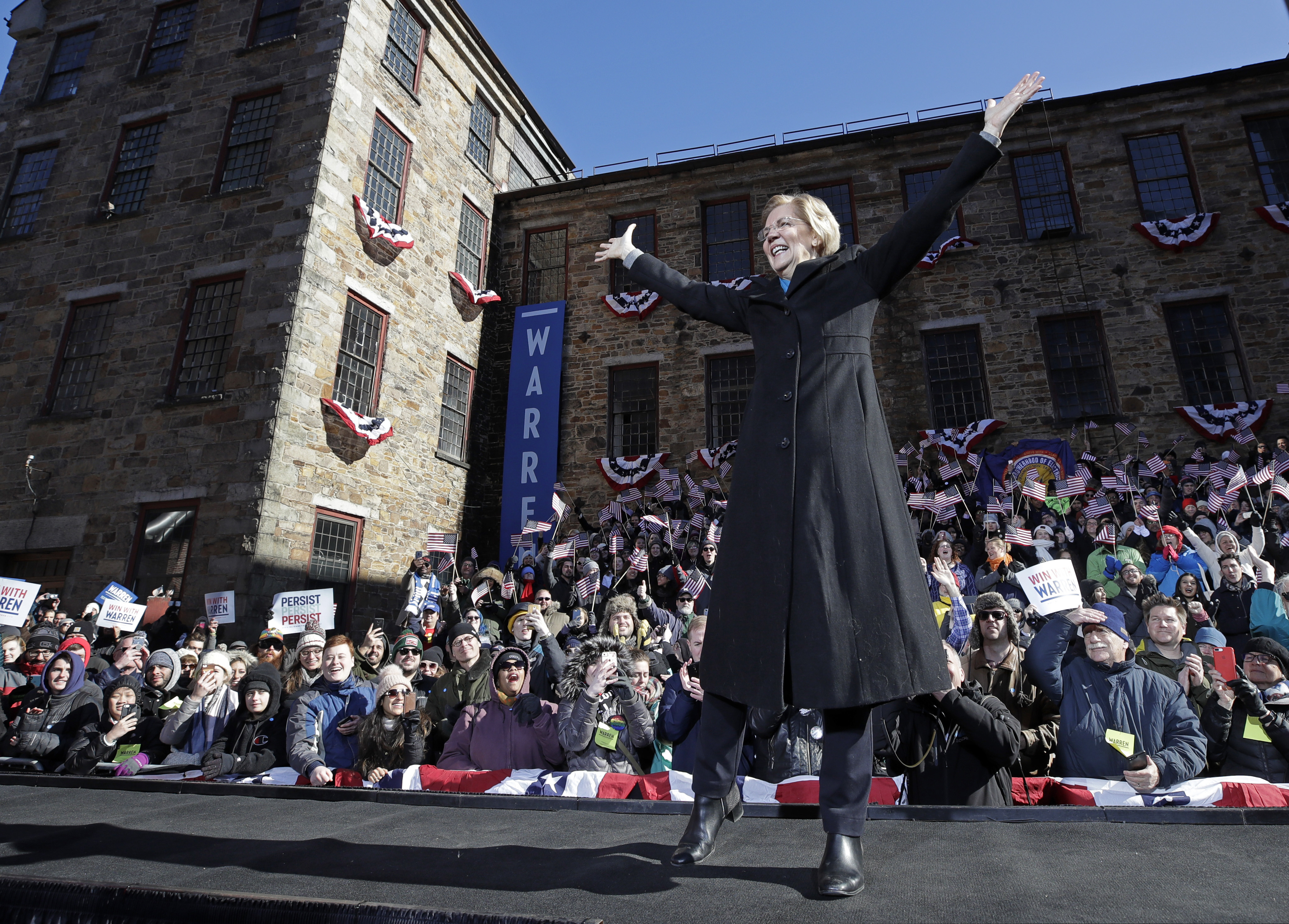 In this Feb. 9, 2019, file photo Sen. Elizabeth Warren, D-Mass., acknowledges cheers as she takes the stage during an event to formally launch her presidential campaign in Lawrence, Mass. Presidential candidates have used thematic songs to great effect in recent times. But using tunes to help connect with voters can cause trouble for presidential hopefuls if musicians object to it. And that’s what Warren could be finding out is the case with Dolly Parton’s “9 to 5.”
