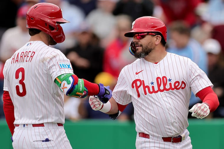 Kyle Schwarber (right) paired with slugger Bryce Harper in the batting has had equal parts success and frustration for the duo.