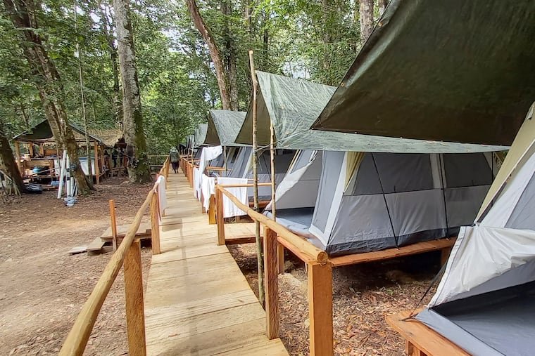 A fishing camp operated by the New Jersey tourism company Acute Angling, sits by the Mapuera River near Bateria, an Indigenous village in the Brazilian Amazon in 2021. Federal courts in Brazil ordered the company to withdraw from the remote area in the Amazon after prosecutors charged the fishing tourism company with operating without government approval and manipulating Indigenous people.