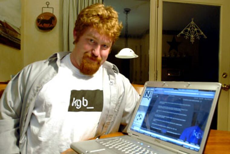 B.J. Ellis wears his KGB t-shirt that was given to him when he became a "KGB agent". (Ron Tarver / Staff Photographer)