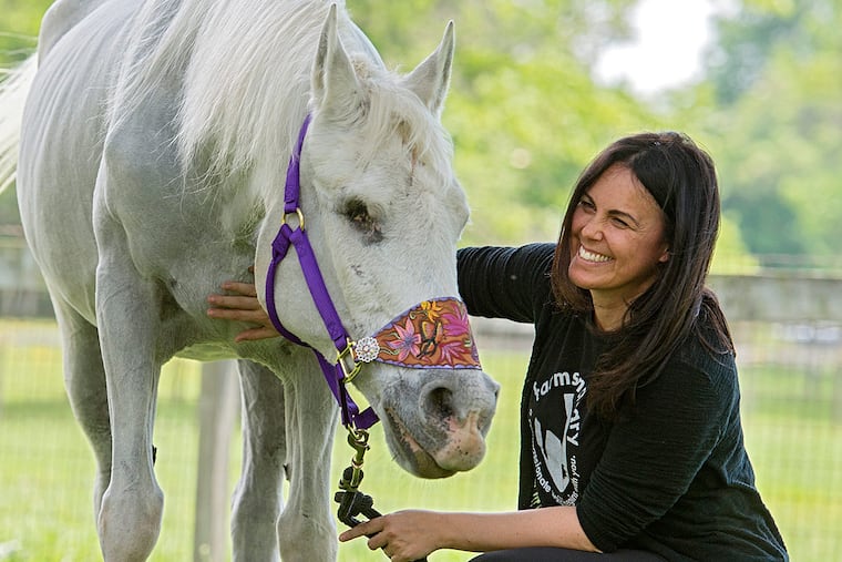 Tracey Stewart and Lily, the horse she and her husband, Jon, have adopted.