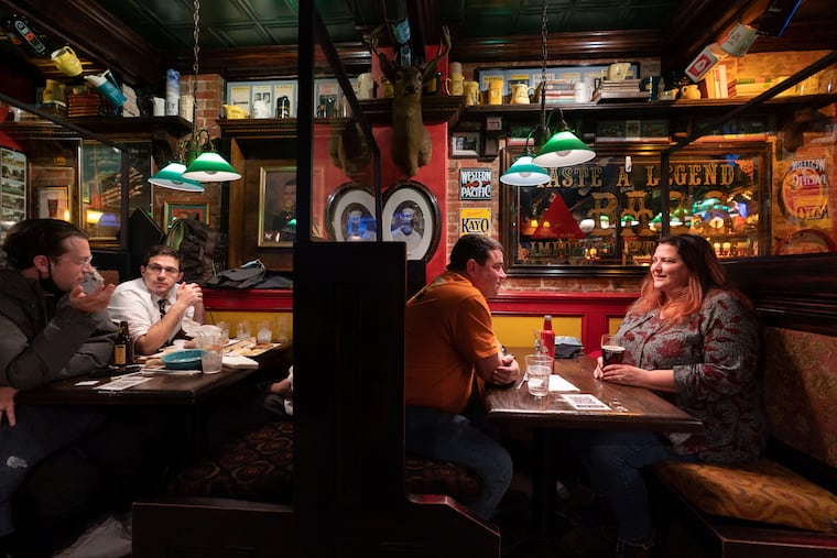 David and Margherita Angelini (right booth) made a point to come to Moriarty's in Center City on the last night of indoor dining prior to the start of renewed coronavirus restrictions on Nov. 19.