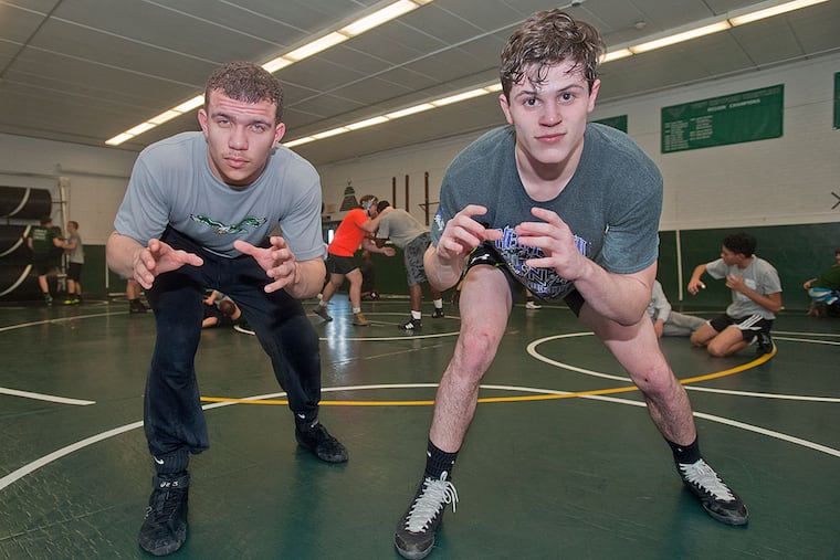 West Deptford High School wrestlers Jason Carter (left) and Cameron Shields.