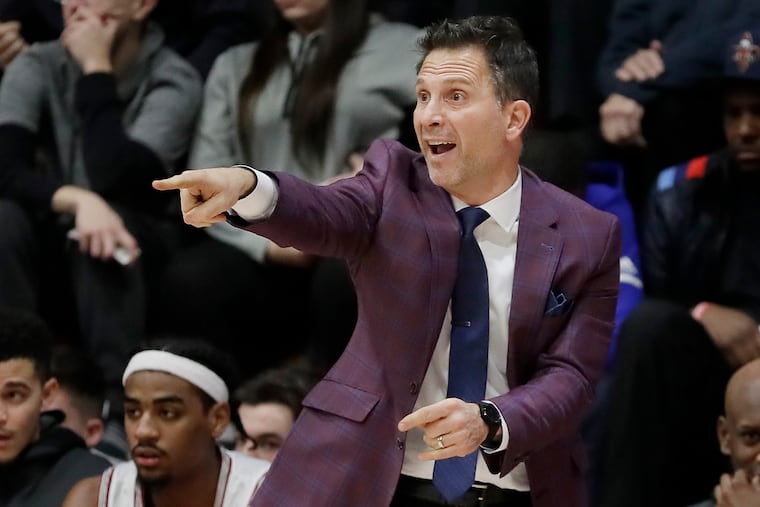 St. Joe’s coach Billy Lange directs players in a recent game against Rhode Island.