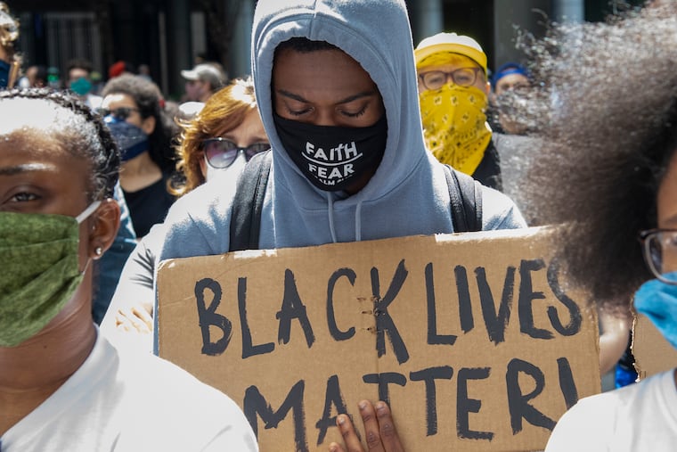 People gather during a Justice for George Floyd protest at the Octavius V. Catto Monument in South Penn Square in Philadelphia on May 31, 2020.