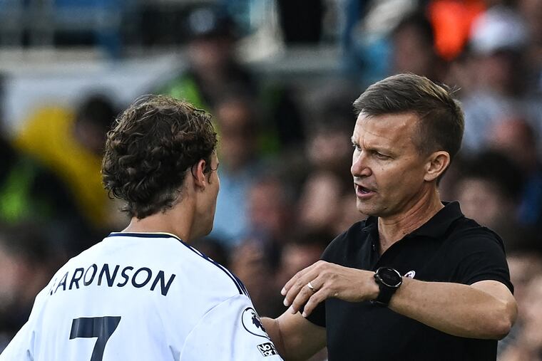 Jesse Marsch (right) with Medford's Brenden Aaronson (left) at a Leeds United game earlier this season.
