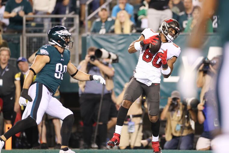 Buccaneers tight end O.J. Howard catches a touchdown past 33-year-old defensive end Ryan Kerrigan.