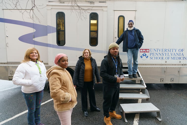 Susan Corrigan (left), a peer specialist who worked as a health navigator and outreach worker at the University of Pennsylvania and the local public health organization Prevention Point, died March 11. in this 2019 photo she stands with colleagues from the University of Pennsylvania (from second from left to right): Aliya Small, case manager, Jody Gilmore, nurse practitioner, and nurse researcher at the Ride Project, Pete Smith, clinical research coordinator, and Ralph Dixon, driver.