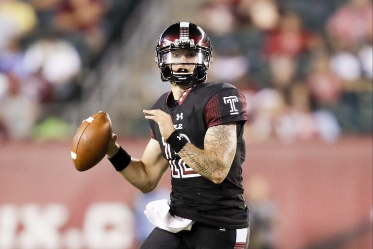 Temple quarterback Logan Marchi runs with the football against UMass.