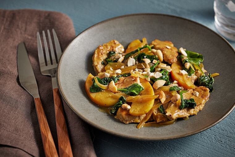Skillet Pork With Apples, Spinach and Curry. MUST CREDIT: Tom McCorkle for The Washington Post; food styling by Gina Nistico for The Washington Post