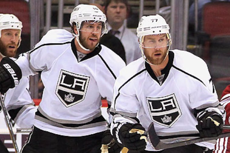 Mike Richards and Jeff Carter could win the Stanley Cup within a year of being traded from Philadelphia. (Ross D. Franklin/AP)