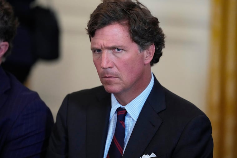 Tucker Carlson attends a meeting with President Donald Trump and oil executives in the East Room of the White House, Jan. 9, 2026, in Washington. He later broke with Trump over the Iran war.