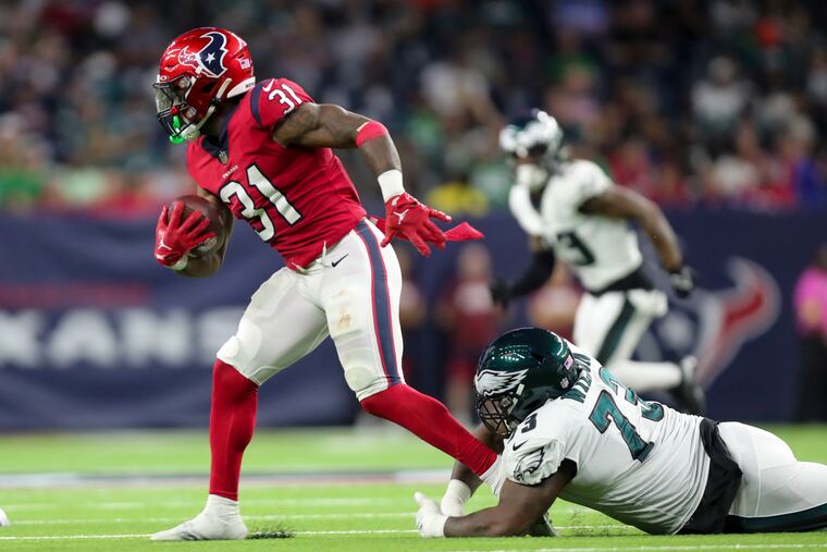 Philadelphia Eagles defensive tackle Marvin Wilson tackles Houston Texans running back Dameon Pierce during the second quarter as the Eagles play the Texas at NRG Stadium in Houston, TX, on Thursday, Nov. 3, 2022, in Houston.