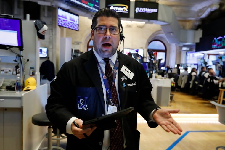 Trader Michael Capolino works on the floor of the New York Stock Exchange, Thursday, Aug. 15, 2019. Stocks are rising on Wall Street early Thursday on indications American consumers continue to spend and embrace online shopping. (AP Photo/Richard Drew)