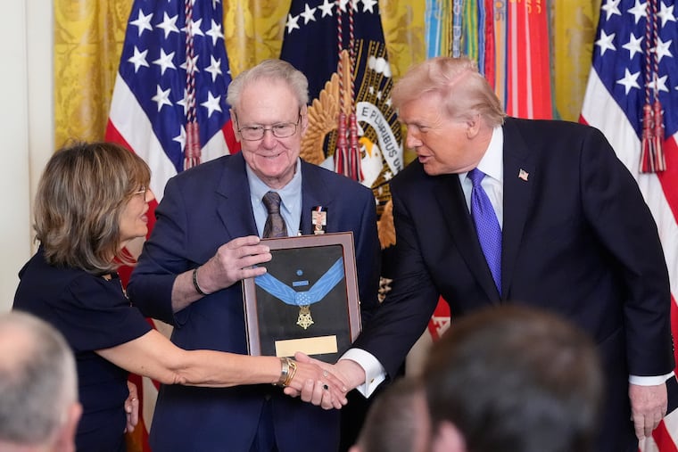 President Donald Trump posthumously presents the Medal Honor to Robert and Linda Ollis, parents of Staff Sergeant Michael Ollis, during a ceremony in the East Room of the White House, Monday, March 2, 2026, in Washington.