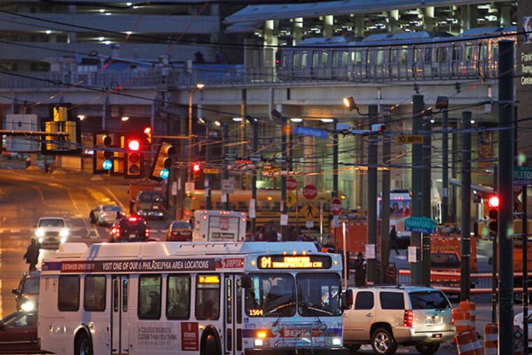 SEPTA buses and Market Frankford Line trains run at the Frankford Transportation Center at Bridge St. and Frankford Ave in Philadelphia on Wednesday, October 31, 2012. ( ALEJANDRO A. ALVAREZ / STAFF PHOTOGRAPHER )
