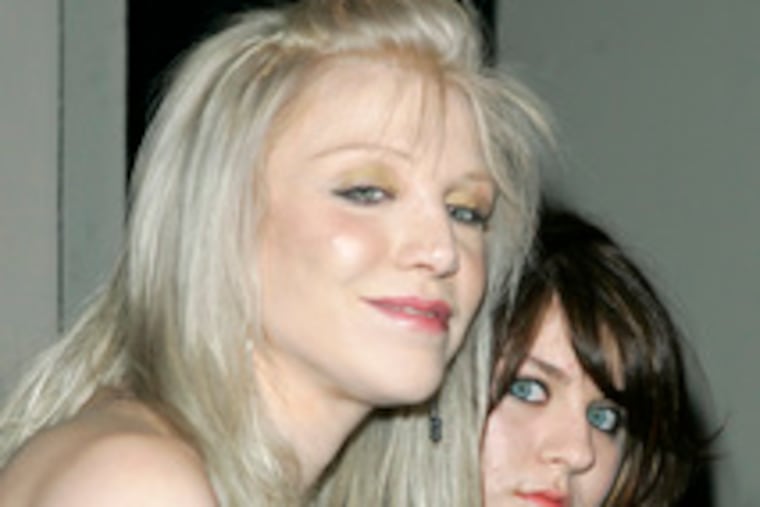 Courtney Love, daughter Frances Bean Cobain in February. Love says she intends to sell most of Kurt Cobain's belongings. (See "Letting go.")
