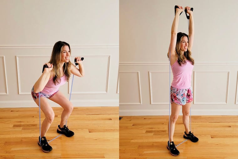 Ashley demonstrates a shoulder press.