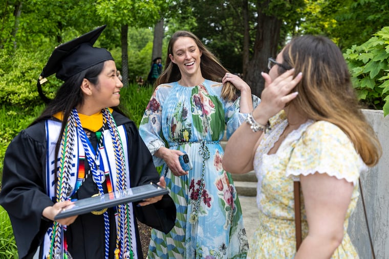 Kylie Kelce, Wife to Former Eagles player Jason Kelce and Graduate of Cabrini class of 2017, chats with Mariana Cruz Sanchez, 22, of Northeast Philadelphia, Pa., Psychology Major and recognized for the Mother Ursula Award, (left), and her friend Sara Peixe, 22, of Northeast Philadelphia, Pa., after graduation at Cabrini University in Radnor, Pa., on Sunday, May, 19, 2024.