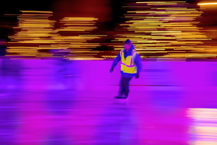 Mike Daily, a skate guard at WinterFest ice skating rink at Cooper River Park in Cherry Hill has a quiet post-holiday evening on the ice.