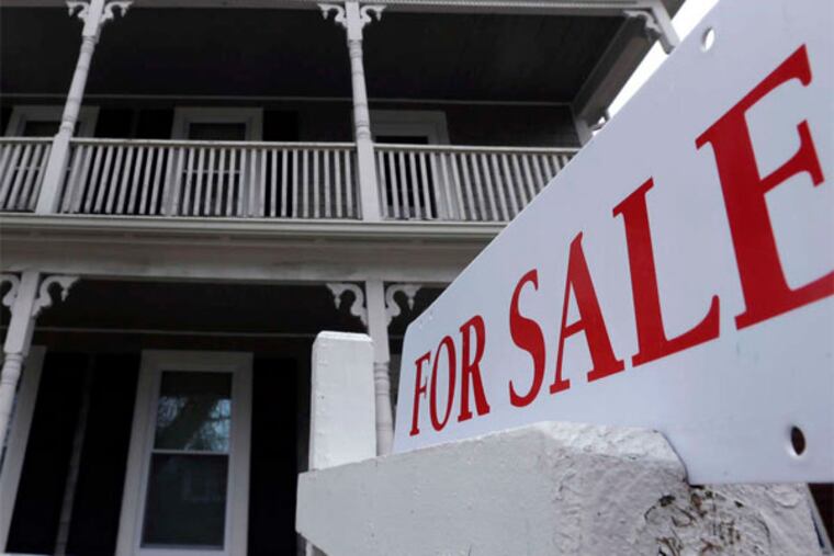 Sales of previously occupied U.S. homes dipped in March, as the supply remained tight. (Steven Senne / Associated Press)