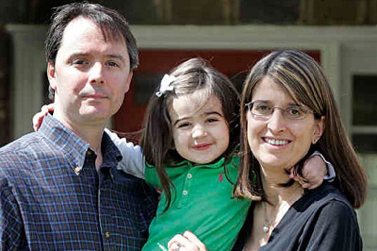 Charlotte Conybear, 4, with parents Jeff and Ellen of Bala Cynwyd. She has a potentially fatal bone-marrow disease and so far no suitable donor has been found. (Bonnie Weller / Staff)