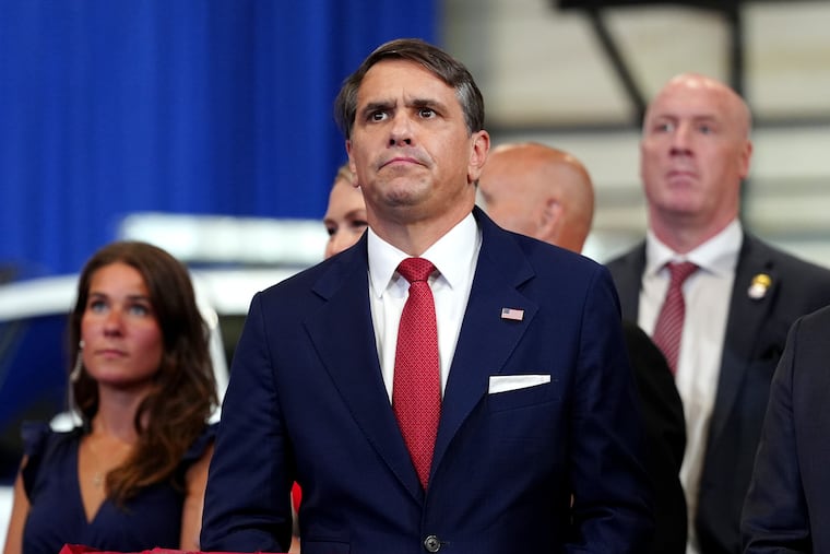 Attorney General Todd Blanche listens as President Donald Trump speaks at the David Mack Center for Training and Intelligence, Friday, Aug. 14, 2026, in Garden City, N.Y.