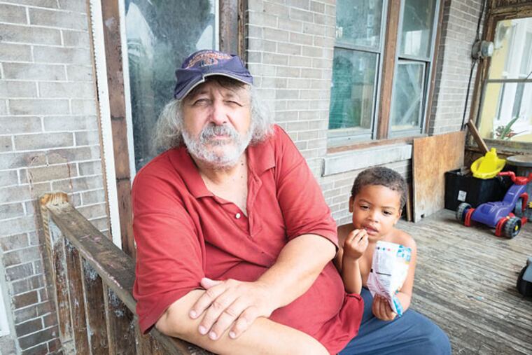 James DiClemente remembers the June 11, 2011, fire that destroyed a former garment factory on Winslow Street. He is unhappy that the site remains a litter- and weed-infested lot four years later. (ED HILLE/Staff Photographer)
