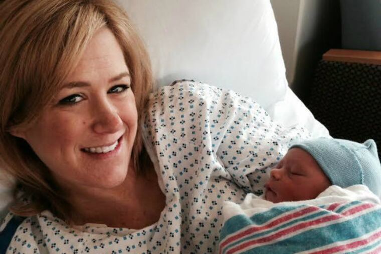 Jamie Apody holds son Chase Alexander.