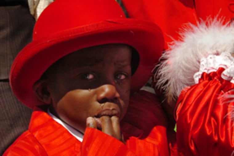 Christopher Jackson, 4, a winner at the Easter Promenade & Finery Contest at Headhouse Square, just wanted to go home.