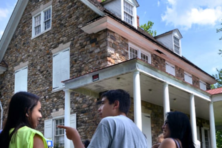 Visitors line up for tours of the Bolton Mansion during the Levittown Days celebration on Sunday afternoon June 24,2012. Photo by Mark C Psoras
