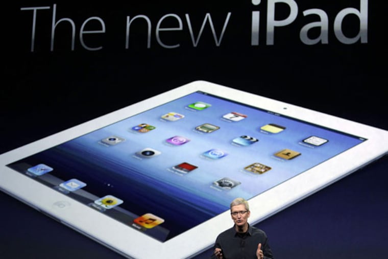 Apple CEO Tim Cook introduces the new iPad during an event in San Francisco, Wednesday, March 7, 2012. The new iPad features a sharper screen and a faster processor. Apple says the new display will be even sharper than the high-definition television set in the living room. (AP Photo/Paul Sakuma)