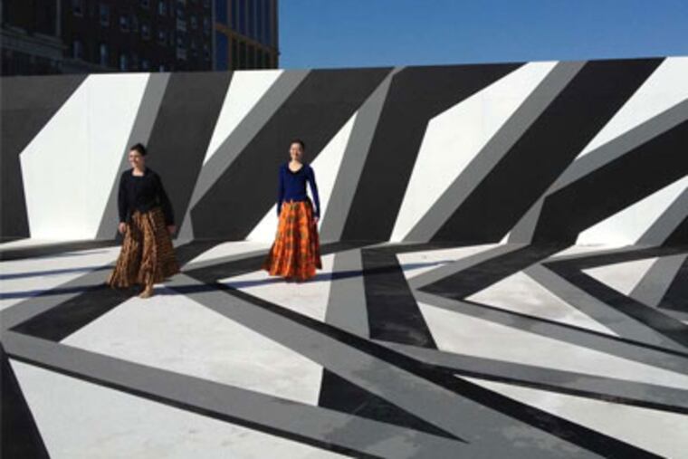 John Roloff’s “Etude Atlantis,” on the Boardwalk, is painted to give the illusion of being a three-dimensional architectural form and shadows. LAYMAN LEE