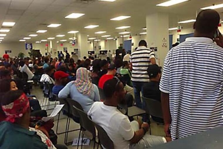 Dozens of people waited for hours Wednesday Sept. 26 at the PennDOT license center at 801 Arch St.
Credit: Andrew Eiser